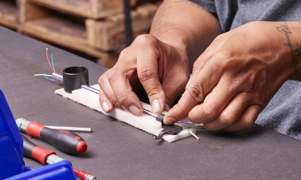 Close-up of a tonearm being assembled